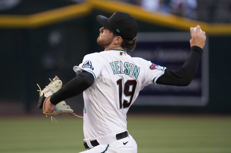 Apr 25, 2023; Phoenix, Arizona, USA; Arizona Diamondbacks starting pitcher Ryne Nelson (19) pitches against the Kansas City Royals during the first inning at Chase Field. Mandatory Credit: Joe Camporeale-USA TODAY Sports