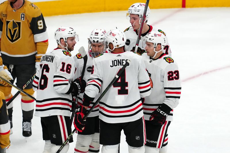 Apr 16, 2024; Las Vegas, Nevada, USA; Chicago Blackhawks center Jason Dickinson (16) celebrates with team mates after scoring a goal against the Vegas Golden Knights during the third period at T-Mobile Arena. Mandatory Credit: Stephen R. Sylvanie-USA TODAY Sports