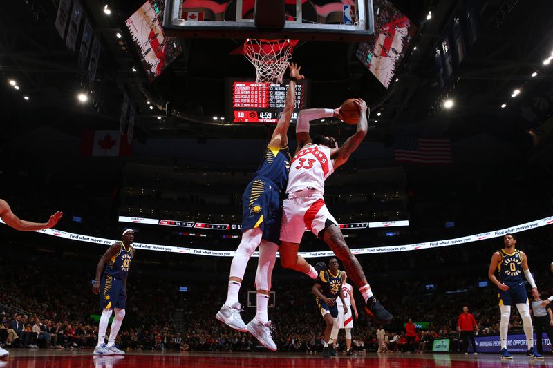 TORONTO, CANADA - APRIL 9:  Gary Trent Jr. #33 of the Toronto Raptors goes to the basket during the game on April 9, 2024 at the Scotiabank Arena in Toronto, Ontario, Canada.  NOTE TO USER: User expressly acknowledges and agrees that, by downloading and or using this Photograph, user is consenting to the terms and conditions of the Getty Images License Agreement.  Mandatory Copyright Notice: Copyright 2024 NBAE (Photo by Vaughn Ridley/NBAE via Getty Images)