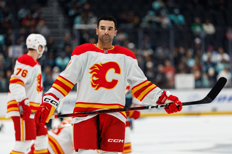 Oct 19, 2024; Seattle, Washington, USA; Calgary Flames center Nazem Kadri (91) warms up before the game against the Seattle Kraken at Climate Pledge Arena. Mandatory Credit: Caean Couto-Imagn Images