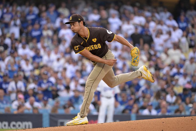 Oct 11, 2024; Los Angeles, California, USA; San Diego Padres pitcher Yu Darvish (11) pitches in the first inning against the Los Angeles Dodgers during game five of the NLDS for the 2024 MLB Playoffs at Dodger Stadium. Mandatory Credit: Jayne Kamin-Oncea-Imagn Images