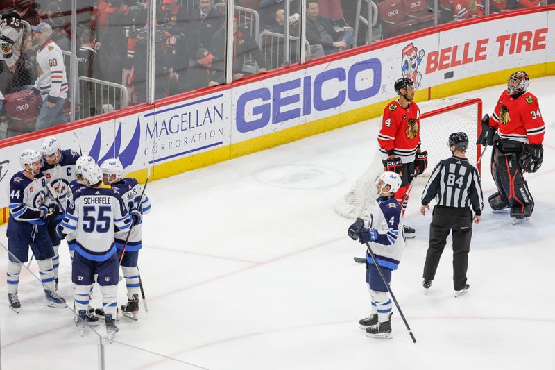 Feb 23, 2024; Chicago, Illinois, USA; Winnipeg Jets left wing Kyle Connor (81) celebrates with teammates after scoring a game winning goal against the Chicago Blackhawks during overtime at United Center. Mandatory Credit: Kamil Krzaczynski-USA TODAY Sports