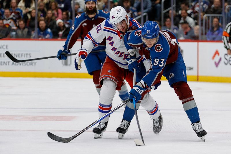 Nov 20, 2025; Denver, Colorado, USA; Colorado Avalanche center Zakhar Bardakov (93) and New York Rangers center Noah Laba (42) battle for the puck in the second period at Ball Arena. Mandatory Credit: Isaiah J. Downing-Imagn Images
