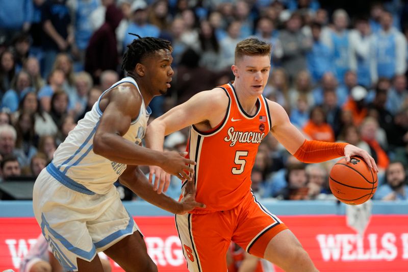 Jan 13, 2024; Chapel Hill, North Carolina, USA; Syracuse Orange guard Justin Taylor (5) with the ball as North Carolina Tar Heels forward Jalen Washington (13) defends in the first half at Dean E. Smith Center. Mandatory Credit: Bob Donnan-USA TODAY Sports