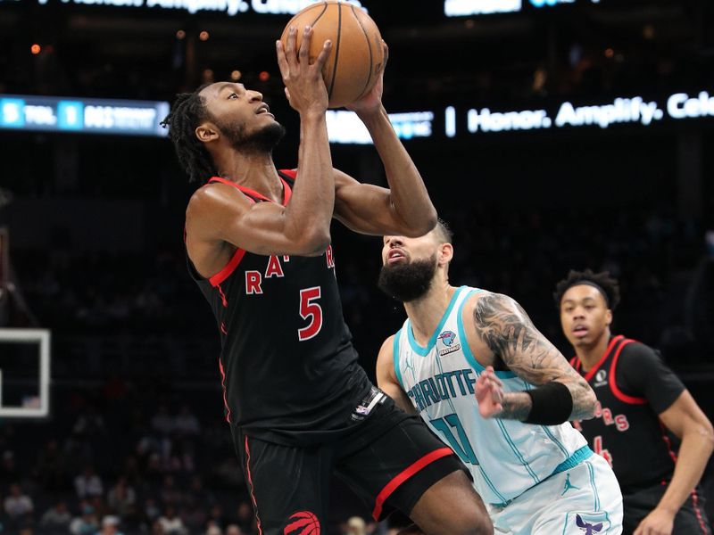 CHARLOTTE, NC - FEBRUARY 7:  Immanuel Quickley #5 of the Toronto Raptors drives to the basket during the game against the Charlotte Hornets on February 7, 2024 at Spectrum Center in Charlotte, North Carolina. NOTE TO USER: User expressly acknowledges and agrees that, by downloading and or using this photograph, User is consenting to the terms and conditions of the Getty Images License Agreement.  Mandatory Copyright Notice:  Copyright 2024 NBAE (Photo by Brock Williams-Smith/NBAE via Getty Images)