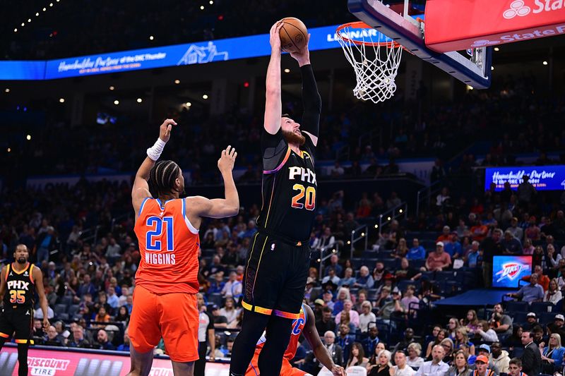 OKLAHOMA CITY, OKLAHOMA - MARCH 29: Jusuf Nurkic #20 of the Phoenix Suns rises up for a dunk during the second half against the Oklahoma City Thunder at Paycom Center on March 29, 2024 in Oklahoma City, Oklahoma. NOTE TO USER: User expressly acknowledges and agrees that, by downloading and or using this Photograph, user is consenting to the terms and conditions of the Getty Images License Agreement. (Photo by Joshua Gateley/Getty Images)