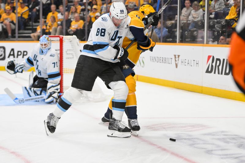 Oct 11, 2025; Nashville, Tennessee, USA;  Utah Mammoth defenseman Nate Schmidt (88) and Nashville Predators left wing Filip Forsberg (9) battle for the puck during the first period at Bridgestone Arena. Mandatory Credit: Steve Roberts-Imagn Images
