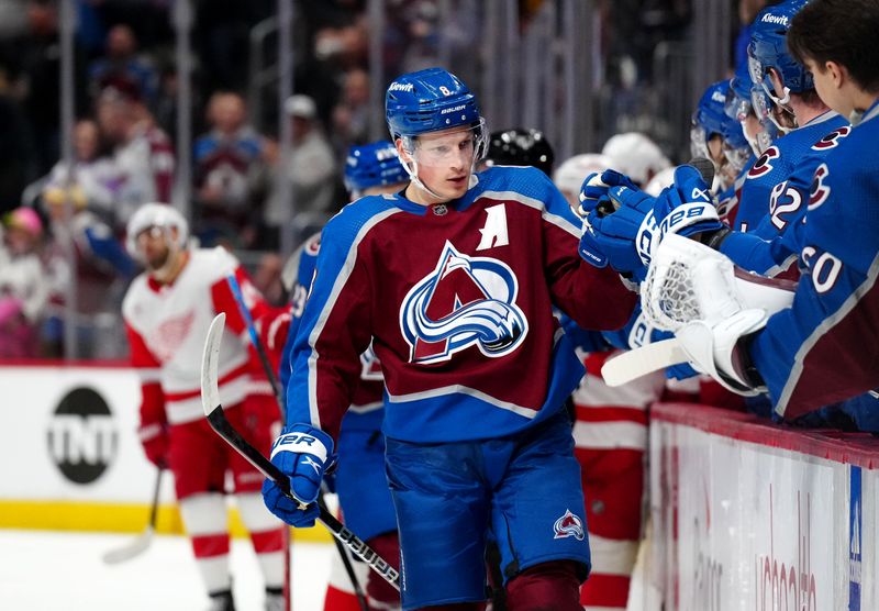 Mar 6, 2024; Denver, Colorado, USA; Colorado Avalanche defenseman Cale Makar (8) celebrates his goal in the first period against the Detroit Red Wings at Ball Arena. Mandatory Credit: Ron Chenoy-USA TODAY Sports