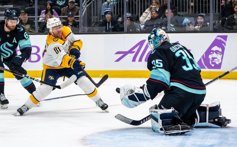 Nov 20, 2024; Seattle, Washington, USA;  Seattle Kraken goalie Joey Daccord (35) makes a save on a shot by Nashville Predators forward Jonathan Marchessault (81) during the third period nat Climate Pledge Arena. Mandatory Credit: Stephen Brashear-Imagn Images