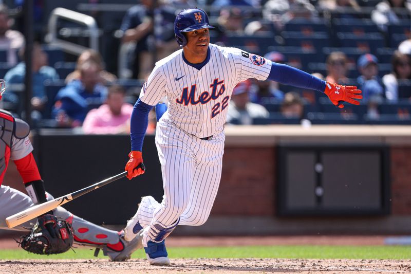 Apr 20, 2025; New York City, New York, USA; New York Mets right fielder Juan Soto (22) singles during the fifth inning against the St. Louis Cardinals at Citi Field. Mandatory Credit: Vincent Carchietta-Imagn Images
