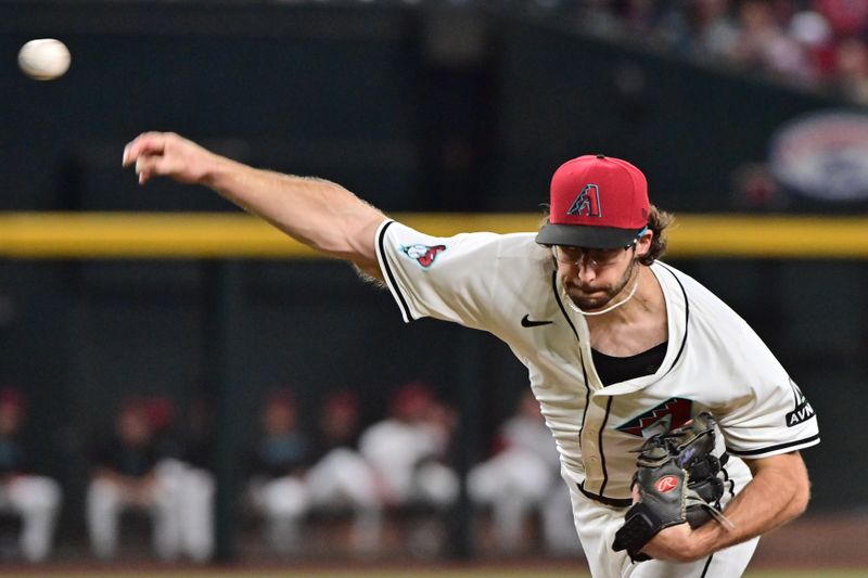 Sep 25, 2024; Phoenix, Arizona, USA; Arizona Diamondbacks pitcher Zac Gallen (23) throws in the first inning against the San Francisco Giants at Chase Field. Mandatory Credit: Matt Kartozian-Imagn Images