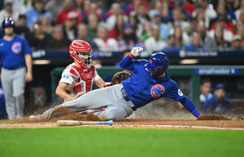 Sep 24, 2024; Philadelphia, Pennsylvania, USA; Chicago Cubs outfielder Seiya Suzuki (27) slides home to score against Philadelphia Phillies catcher Garrett Stubbs (21) in the second inning at Citizens Bank Park. Mandatory Credit: Kyle Ross-Imagn Images