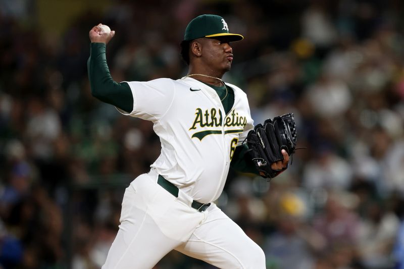 Sep 27, 2025; West Sacramento, California, USA; Athletics pitcher Elvis Alvarado (61) throws a pitch against the Kansas City Royals during the fifth inning at Sutter Health Park. Mandatory Credit: Dennis Lee-Imagn Images