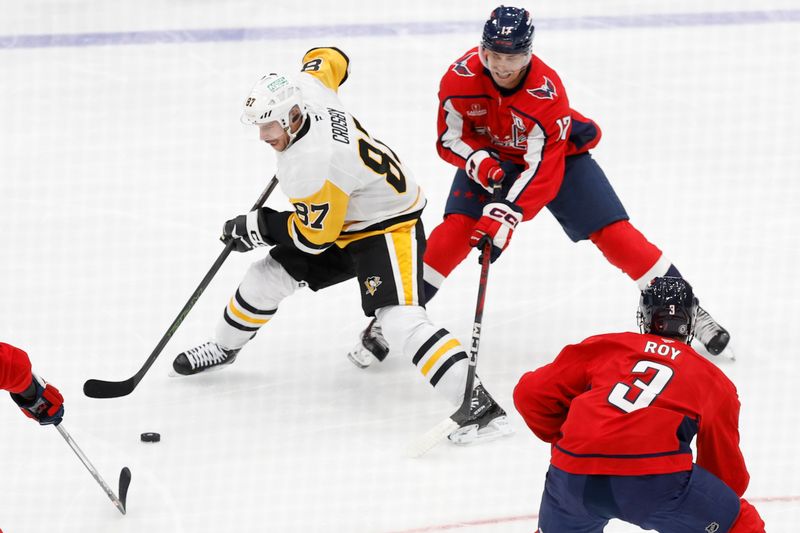 Nov 8, 2024; Washington, District of Columbia, USA; Pittsburgh Penguins center Sidney Crosby (87) skates with the puck as Washington Capitals center Dylan Strome (17) defends in the first period at Capital One Arena. Mandatory Credit: Geoff Burke-Imagn Images