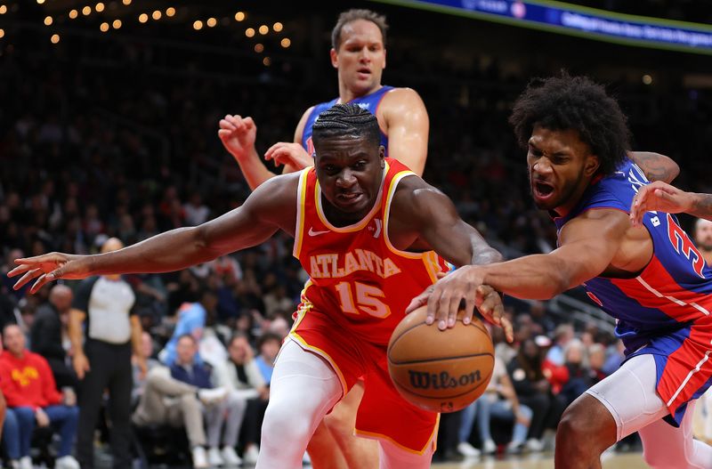 ATLANTA, GEORGIA - DECEMBER 18:  Clint Capela #15 of the Atlanta Hawks battles for a rebound against Marvin Bagley III #35 of the Detroit Pistons during the second quarter at State Farm Arena on December 18, 2023 in Atlanta, Georgia.  NOTE TO USER: User expressly acknowledges and agrees that, by downloading and/or using this photograph, user is consenting to the terms and conditions of the Getty Images License Agreement.  (Photo by Kevin C. Cox/Getty Images)