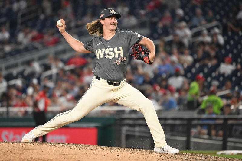 Jul 5, 2024; Washington, District of Columbia, USA; Washington Nationals relief pitcher Hunter Harvey (73) throws a pitch against the St. Louis Cardinals during the seventh inning at Nationals Park. Mandatory Credit: Rafael Suanes-USA TODAY Sports