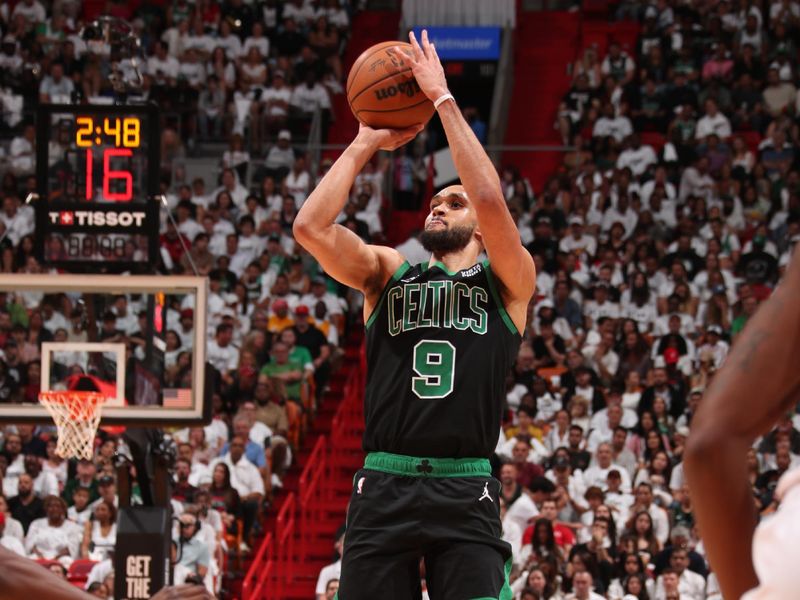 MIAMI, FL - APRIL 27: Derrick White #9 of the Boston Celtics shoots a three point basket during the game against the Miami Heat during Round 1 Game 3 of the 2024 NBA Playoffs on April 27, 2024 at Kaseya Center in Miami, Florida. NOTE TO USER: User expressly acknowledges and agrees that, by downloading and or using this Photograph, user is consenting to the terms and conditions of the Getty Images License Agreement. Mandatory Copyright Notice: Copyright 2024 NBAE (Photo by Issac Baldizon/NBAE via Getty Images)