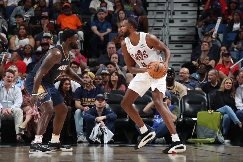 NEW ORLEANS, LA - NOVEMBER 6: Evan Mobley #4 of the Cleveland Cavaliers handles the ball during the game against the New Orleans Pelicans on November 6, 2024 at the Smoothie King Center in New Orleans, Louisiana. NOTE TO USER: User expressly acknowledges and agrees that, by downloading and or using this Photograph, user is consenting to the terms and conditions of the Getty Images License Agreement. Mandatory Copyright Notice: Copyright 2024 NBAE (Photo by Layne Murdoch Jr./NBAE via Getty Images)