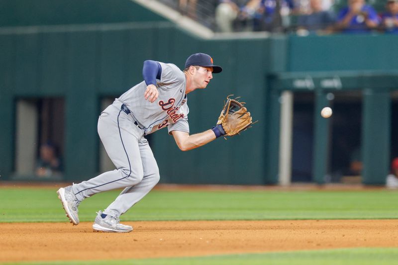 Jun 4, 2024; Arlington, Texas, USA; Detroit Tigers second base Colt Keith (33) fields a ground ball during the eighth inning against the Texas Rangers at Globe Life Field. Mandatory Credit: Andrew Dieb-USA TODAY Sports