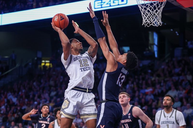 Jan 20, 2024; Atlanta, Georgia, USA; Georgia Tech Yellow Jackets forward Tyzhaun Claude (12) shoots over Virginia Cavaliers guard Ryan Dunn (13) in the second half at McCamish Pavilion. Mandatory Credit: Brett Davis-USA TODAY Sports