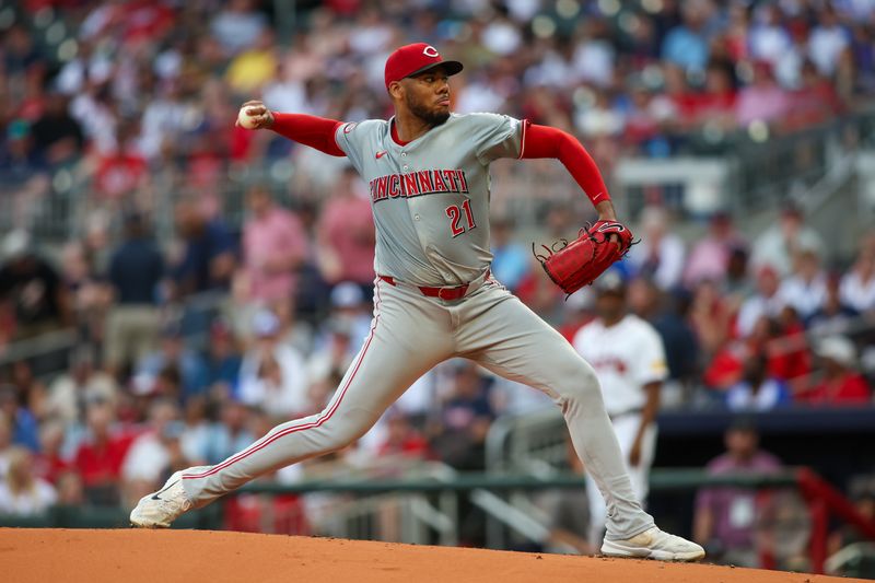 Jul 22, 2024; Atlanta, Georgia, USA; Cincinnati Reds starting pitcher Hunter Greene (21) throws against the Atlanta Braves in the second inning at Truist Park. Mandatory Credit: Brett Davis-USA TODAY Sports