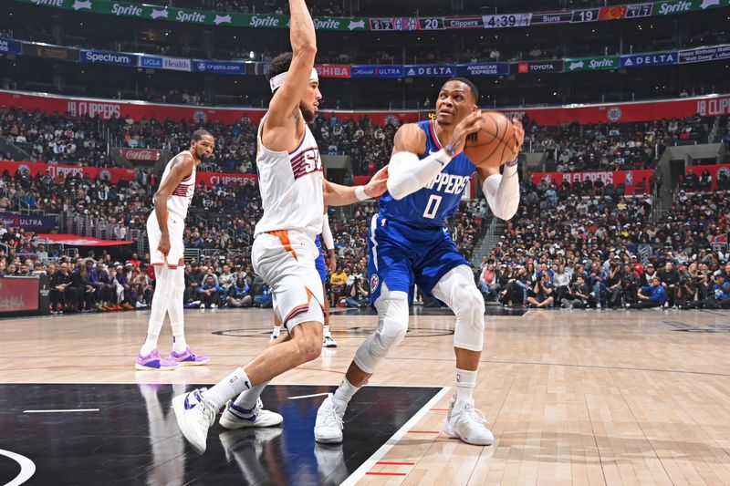 LOS ANGELES, CA - JANUARY 8: Russell Westbrook #0 of the LA Clippers handles the ball during the game against the Phoenix Suns on January 8, 2024 at Crypto.Com Arena in Los Angeles, California. NOTE TO USER: User expressly acknowledges and agrees that, by downloading and/or using this Photograph, user is consenting to the terms and conditions of the Getty Images License Agreement. Mandatory Copyright Notice: Copyright 2024 NBAE (Photo by Andrew D. Bernstein/NBAE via Getty Images)