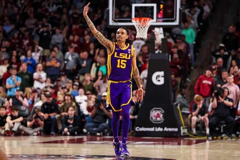 Feb 17, 2024; Columbia, South Carolina, USA; LSU Tigers forward Tyrell Ward (15) celebrates a three point basket against the South Carolina Gamecocks in the second half at Colonial Life Arena. Mandatory Credit: Jeff Blake-USA TODAY Sports