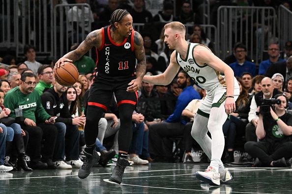 BOSTON, MASSACHUSETTS - NOVEMBER 28: DeMar DeRozan #11 of the Chicago Bulls drives to the basket against Sam Hauser #30 of the Boston Celtics during the second quarter of an NBA In-Season Tournament game at the TD Garden on November 28, 2023 in Boston, Massachusetts. NOTE TO USER: User expressly acknowledges and agrees that, by downloading and or using this photograph, User is consenting to the terms and conditions of the Getty Images License Agreement. (Photo by Brian Fluharty/Getty Images)