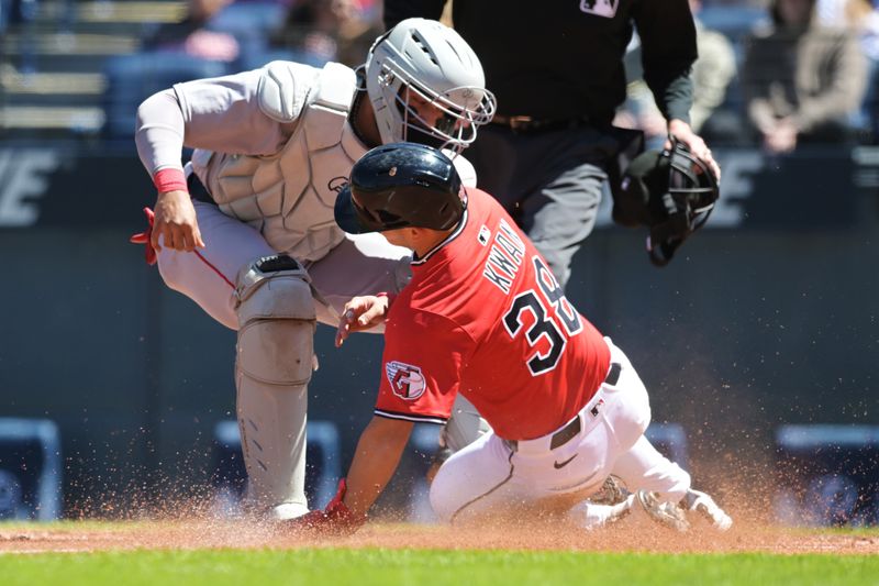 Apr 27, 2025; Cleveland, Ohio, USA; Boston Red Sox catcher Carlos Narvaez (75) tags out Cleveland Guardians left fielder Steven Kwan (38) during the first inning at Progressive Field. Mandatory Credit: Ken Blaze-Imagn Images