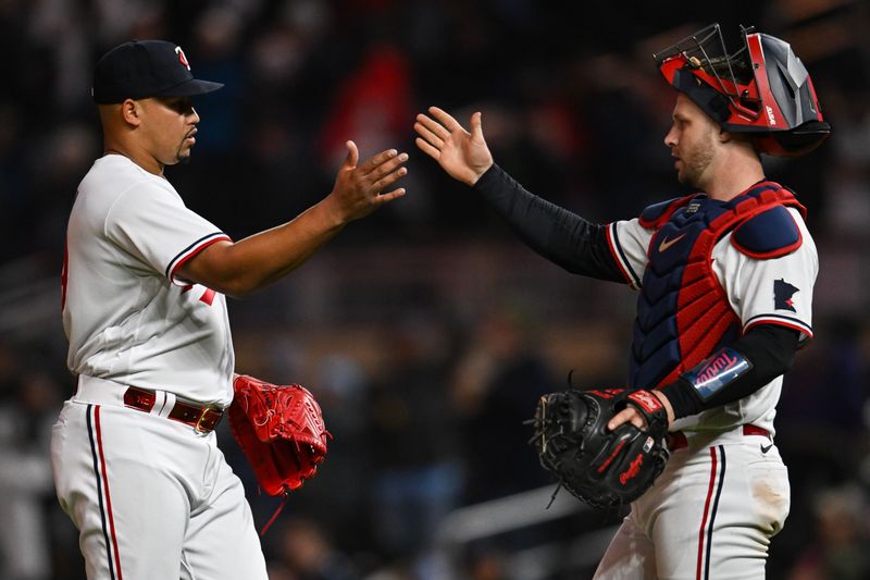 Apr 25, 2023; Minneapolis, Minnesota, USA; Minnesota Twins relief pitcher Jhoan Duran (59) and catcher Ryan Jeffers (27) celebrate after a game against the New York Yankees at Target Field. Mandatory Credit: Jeffrey Becker-USA TODAY Sports