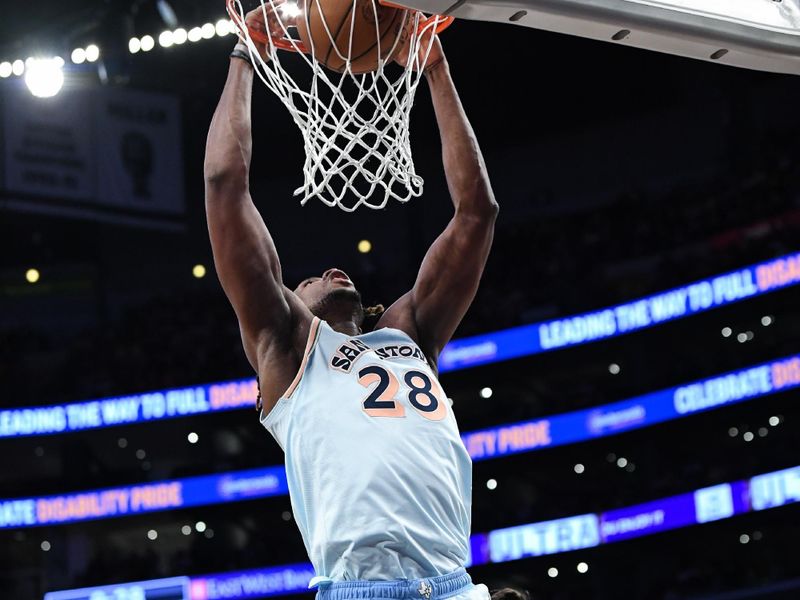 LOS ANGELES, CA - JANUARY 13: Charles Bassey #28 of the San Antonio Spurs dunks the ball during the game against the Los Angeles Lakers on January 13, 2025 at Crypto.Com Arena in Los Angeles, California. NOTE TO USER: User expressly acknowledges and agrees that, by downloading and/or using this Photograph, user is consenting to the terms and conditions of the Getty Images License Agreement. Mandatory Copyright Notice: Copyright 2025 NBAE (Photo by Noah Graham/NBAE via Getty Images)