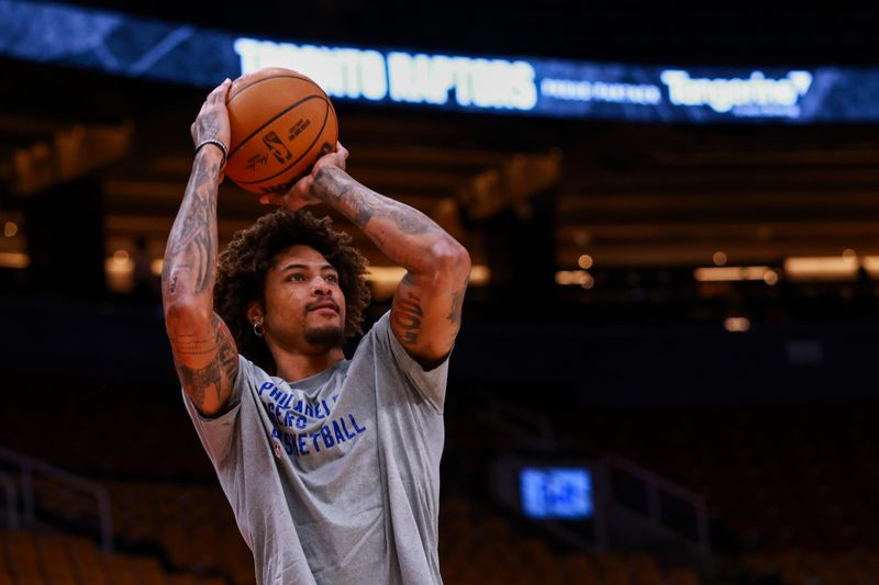 TORONTO, CANADA - MARCH 31: Kelly Oubre Jr. #9 of the Philadelphia 76ers warms up before the game against the Toronto Raptors on March 31, 2024 at the Scotiabank Arena in Toronto, Ontario, Canada.  NOTE TO USER: User expressly acknowledges and agrees that, by downloading and or using this Photograph, user is consenting to the terms and conditions of the Getty Images License Agreement.  Mandatory Copyright Notice: Copyright 2024 NBAE (Photo by Vaughn Ridley/NBAE via Getty Images)