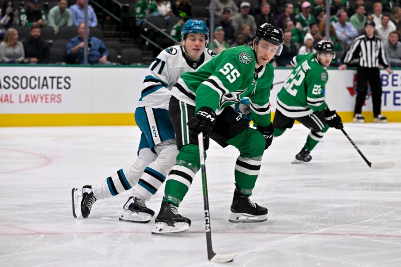 Nov 20, 2024; Dallas, Texas, USA; San Jose Sharks center Macklin Celebrini (71) and Dallas Stars defenseman Thomas Harley (55) battle for control of the puck during the first period at the American Airlines Center. Mandatory Credit: Jerome Miron-Imagn Images