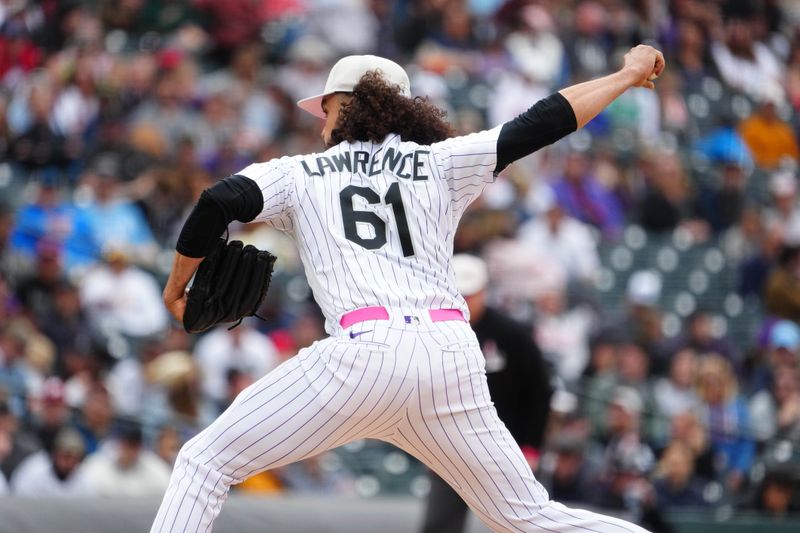 May 14, 2023; Denver, Colorado, USA; Colorado Rockies relief pitcher Justin Lawrence (61) delivers a pitch in the ninth inning against the Philadelphia Phillies at Coors Field. Mandatory Credit: Ron Chenoy-USA TODAY Sports