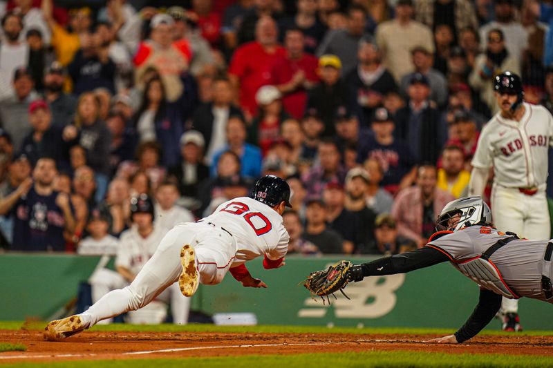 Sep 9, 2024; Boston, Massachusetts, USA; Boston Red Sox right fielder Rob Refsnyder (30) tagged out at home plate by Baltimore Orioles catcher Adley Rutschman (35) in the fifth inning at Fenway Park. Mandatory Credit: David Butler II-Imagn Images