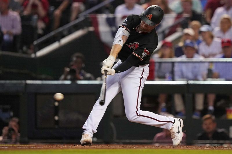 Oct 20, 2023; Phoenix, Arizona, USA; Arizona Diamondbacks outfielder Pavin Smith (26) hits a single during the sixth inning against the Philadelphia Phillies in game four of the NLCS for the 2023 MLB playoffs at Chase Field. Mandatory Credit: Joe Camporeale-USA TODAY Sports