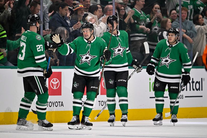 Oct 26, 2024; Dallas, Texas, USA; Dallas Stars defenseman Esa Lindell (23) and right wing Evgenii Dadonov (63) and left wing Mason Marchment (27) and center Logan Stankoven (11) celebrates a goal scored by Dadonov against the Chicago Blackhawks during the first period at the American Airlines Center. Mandatory Credit: Jerome Miron-Imagn Images