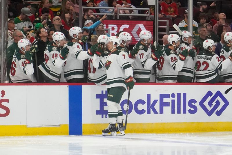 Oct 4, 2024; Chicago, Illinois, USA; Minnesota Wild defenseman Brock Faber (7) celebrates his goal against the Chicago Blackhawks during the third period at United Center. Mandatory Credit: David Banks-Imagn Images