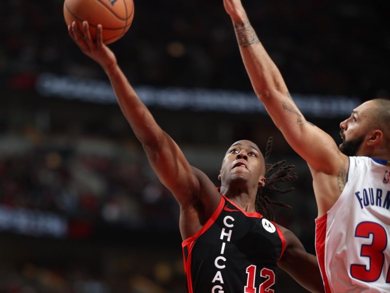 CHICAGO, IL -FEBRUARY 27: Ayo Dosunmu #12 of the Chicago Bulls drives to the basket during the game against the Detroit Pistons on February 27, 2024 at United Center in Chicago, Illinois. NOTE TO USER: User expressly acknowledges and agrees that, by downloading and or using this photograph, User is consenting to the terms and conditions of the Getty Images License Agreement. Mandatory Copyright Notice: Copyright 2024 NBAE (Photo by Jeff Haynes/NBAE via Getty Images)