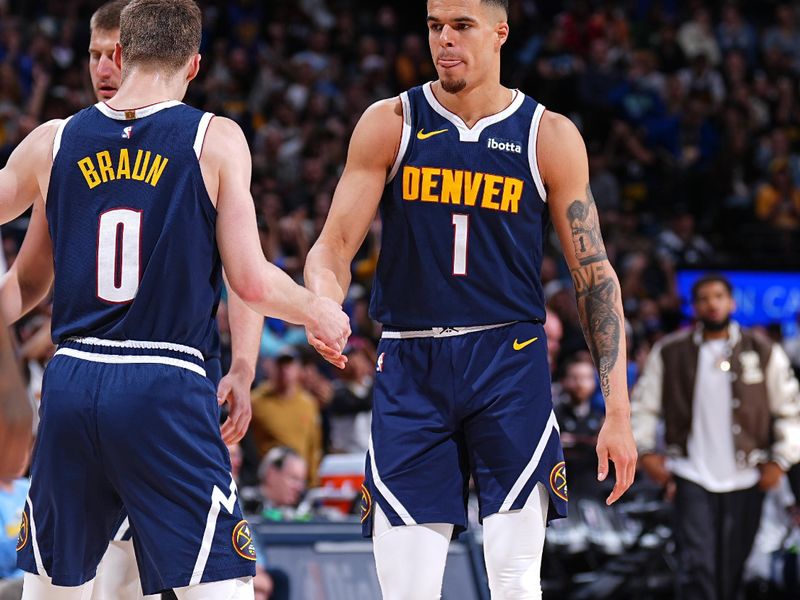 DENVER, CO - APRIL 10: Christian Braun #0 and Michael Porter Jr. #1 of the Denver Nuggets high five during the game against the Minnesota Timberwolves on April 10, 2024 at the Ball Arena in Denver, Colorado. NOTE TO USER: User expressly acknowledges and agrees that, by downloading and/or using this Photograph, user is consenting to the terms and conditions of the Getty Images License Agreement. Mandatory Copyright Notice: Copyright 2024 NBAE (Photo by Garrett Ellwood/NBAE via Getty Images)