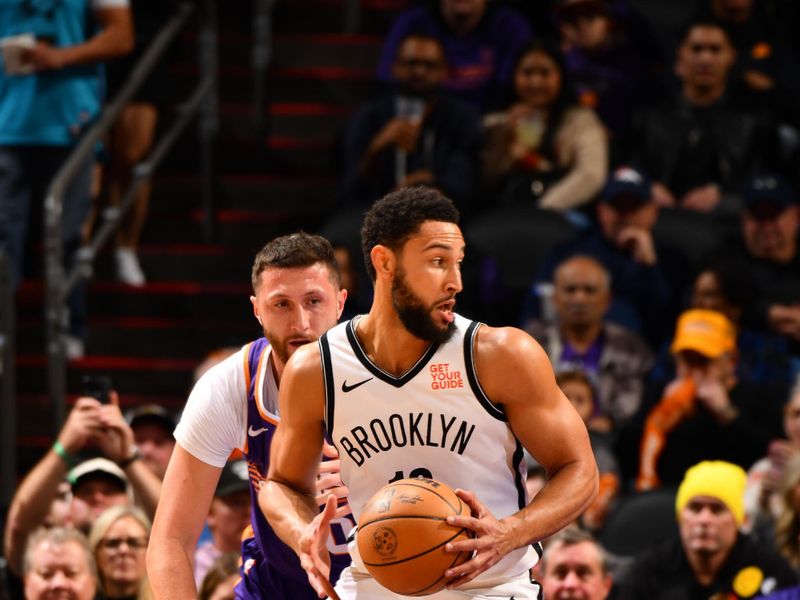 PHOENIX, AZ - NOVEMBER 27: Ben Simmons #10 of the Brooklyn Nets handles the ball during the game against the Phoenix Suns on November 27, 2024 at Footprint Center in Phoenix, Arizona. NOTE TO USER: User expressly acknowledges and agrees that, by downloading and or using this photograph, user is consenting to the terms and conditions of the Getty Images License Agreement. Mandatory Copyright Notice: Copyright 2024 NBAE (Photo by Barry Gossage/NBAE via Getty Images)