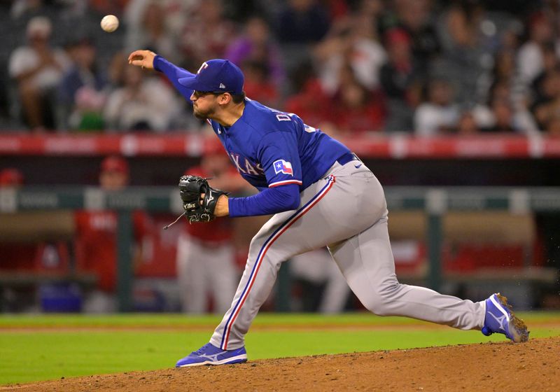 Sep 27, 2023; Anaheim, California, USA;  Texas Rangers starting pitcher Dane Dunning (33) delivers in the sixth inning against the Los Angeles Angels at Angel Stadium. Mandatory Credit: Jayne Kamin-Oncea-USA TODAY Sports