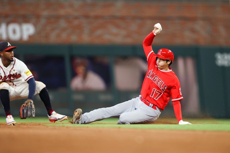 Aug 1, 2023; Atlanta, Georgia, USA; Los Angeles Angels designated hitter Shohei Ohtani (17) steals second base against the Atlanta Braves in the sixth inning at Truist Park. Mandatory Credit: Brett Davis-USA TODAY Sports