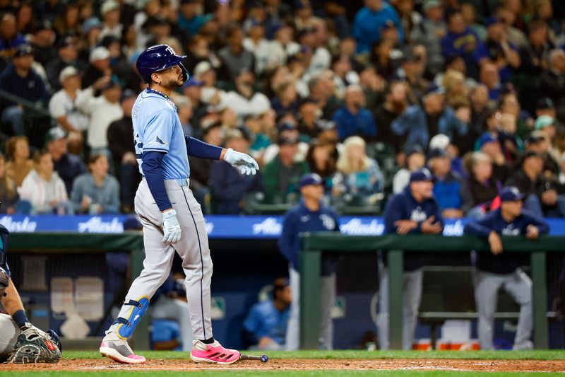 Aug 27, 2024; Seattle, Washington, USA; Tampa Bay Rays center fielder Jose Siri (22) watches his two-run home run against the Seattle Mariners during the seventh inning at T-Mobile Park. Mandatory Credit: Joe Nicholson-USA TODAY Sports