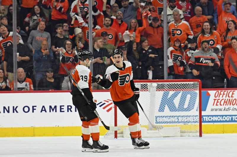 Apr 14, 2026; Philadelphia, Pennsylvania, USA; Philadelphia Flyers right wing Porter Martone (94) celebrates his goal with right wing Matvei Michkov (39) against the Montréal Canadiens during the first period at Xfinity Mobile Arena. Mandatory Credit: Eric Hartline-Imagn Images Apr 14, 2026; Philadelphia, Pennsylvania, USA; Philadelphia Flyers right wing Porter Martone (94) celebrates his goal with right wing Matvei Michkov (39) against the Montréal Canadiens during the first period at Xfinity Mobile Arena. Mandatory Credit: Eric Hartline-Imagn Images