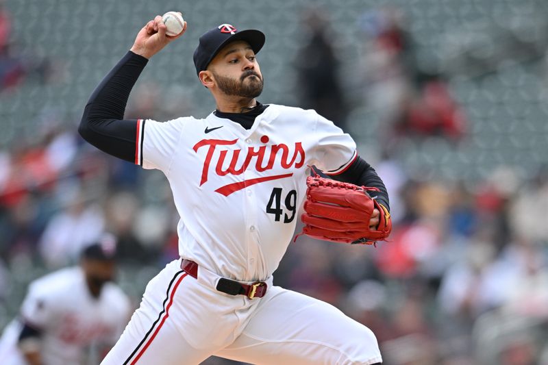 May 4, 2024; Minneapolis, Minnesota, USA; Minnesota Twins pitcher Pablo López (49) throws a pitch against the Minnesota Twins during the first inning at Target Field. Mandatory Credit: Jeffrey Becker-USA TODAY Sports