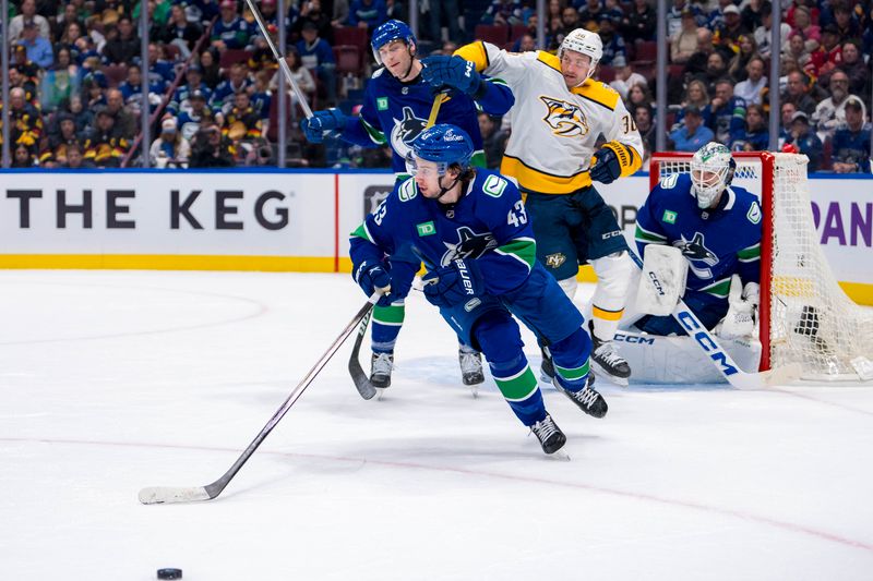 Apr 21, 2024; Vancouver, British Columbia, CAN; Vancouver Canucks defenseman Quinn Hughes (43) handles the puck against the Nashville Predators in the second period in game one of the first round of the 2024 Stanley Cup Playoffs at Rogers Arena. Mandatory Credit: Bob Frid-USA TODAY Sports