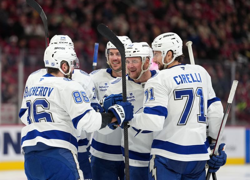 Dec 9, 2025; Montreal, Quebec, CAN; Tampa Bay Lightning defenseman Darren Raddysh (43) celebrates with teammates including forward Nikita Kucherov (86) and defenseman Max crozier (24) and forward Anthony Cirelli (71) after scoring a goal against the Montreal Canadiens during the third period at the Bell Centre. Mandatory Credit: Eric Bolte-Imagn Images