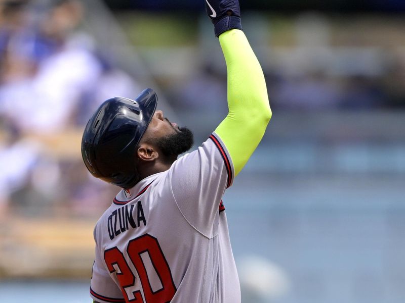 Sep 3, 2023; Los Angeles, California, USA;   Atlanta Braves designated hitter Marcell Ozuna (20) points to the sky after a double in the second inning against the Los Angeles Dodgers at Dodger Stadium. Mandatory Credit: Jayne Kamin-Oncea-USA TODAY Sports