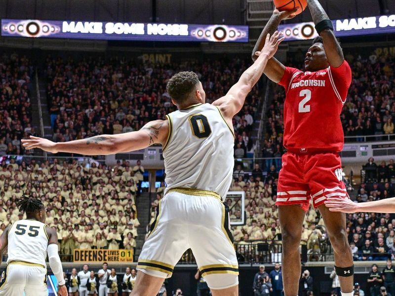 Mar 10, 2024; West Lafayette, Indiana, USA; Wisconsin Badgers guard AJ Storr (2) shoots the ball over Purdue Boilermakers forward Mason Gillis (0) during the first half at Mackey Arena. Mandatory Credit: Marc Lebryk-USA TODAY Sports